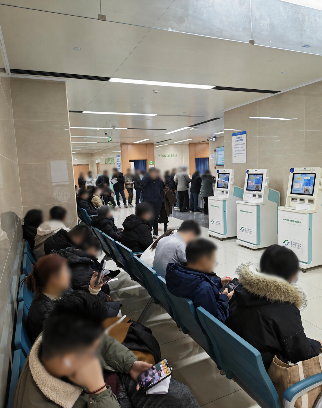 Hospital registration and waiting area in China, with faces blurred for privacy